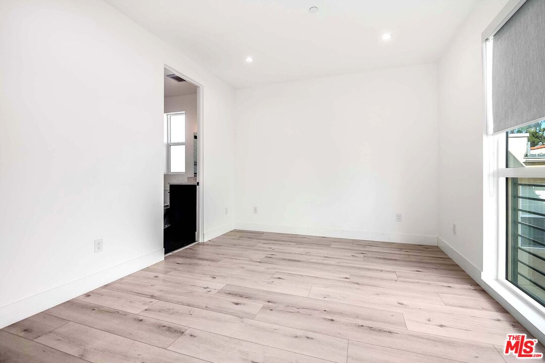 15330 Weddington Street Sherman Oaks, CA 91411 - Photo 23 of 30 a view of empty room with wooden floor