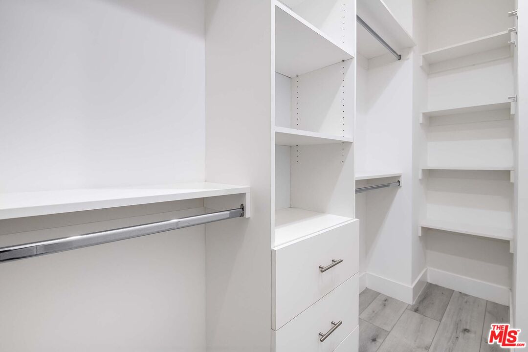 15330 Weddington Street Sherman Oaks, CA 91411 - Photo 26 of 30 a hallway with cabinets