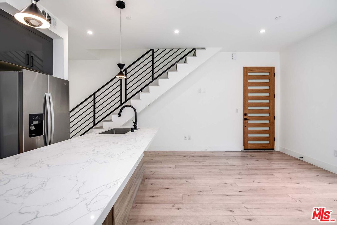 15330 Weddington Street Sherman Oaks, CA 91411 - Photo 8 of 30 a view of entryway and hall with wooden floor