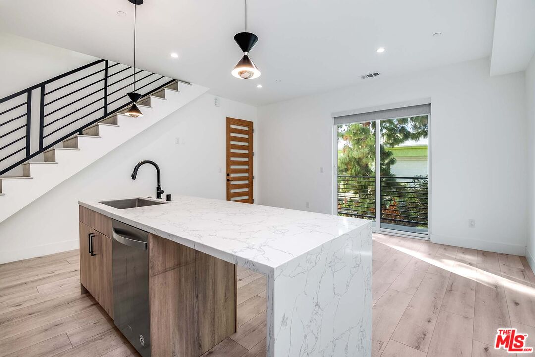 15330 Weddington Street Sherman Oaks, CA 91411 - Photo 9 of 30 a kitchen with a sink and a window