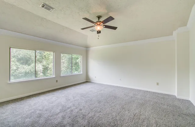 a view of an empty room with a window