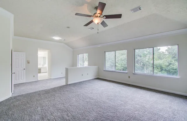 a view of an empty room with a window