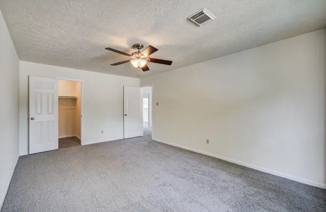 an empty room with a bathroom