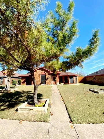 a view of residential houses with outdoor space