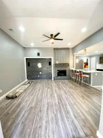 a view of a livingroom with furniture and a fireplace