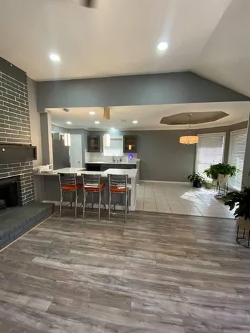 a room with lots of furniture and a fireplace