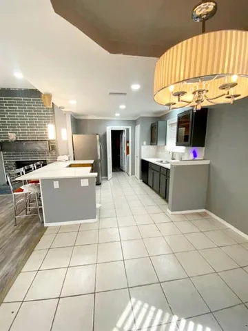 a kitchen with stainless steel appliances a sink and cabinets
