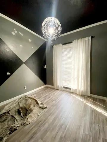 a view of a livingroom with wooden floor