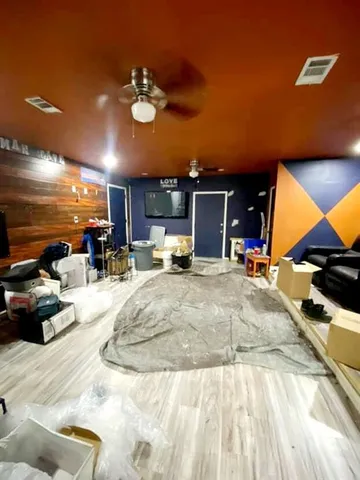 a view of a swimming pool with furniture