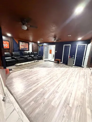 a view of a livingroom with furniture and a kitchen