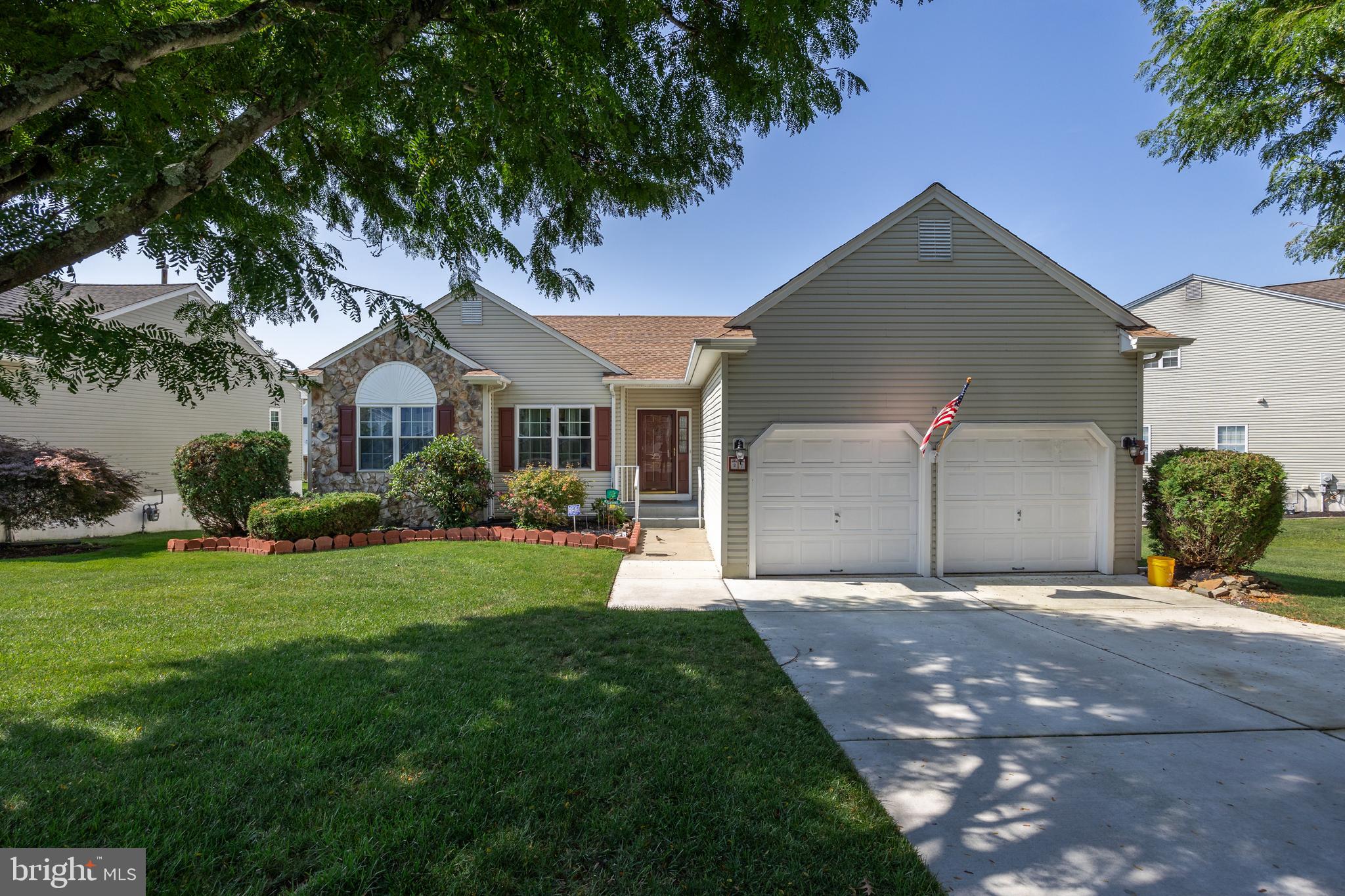 27 Ashley Drive Delran, NJ 08075 - Photo 1 of 35 a front view of a house with a yard and garage