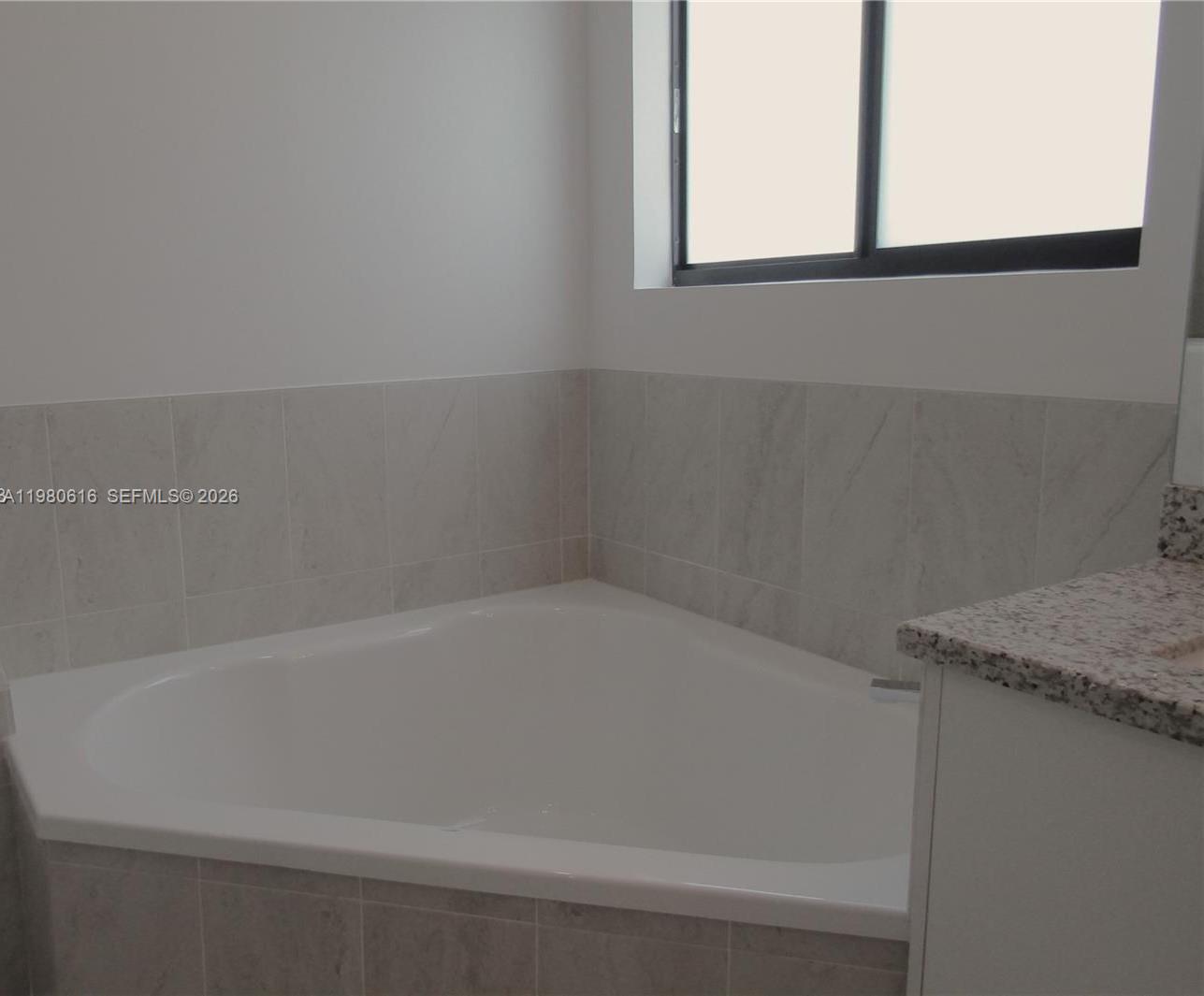 11998 Southwest 232nd Street Miami, FL 33170 - Photo 17 of 26 a close up of a bathtub