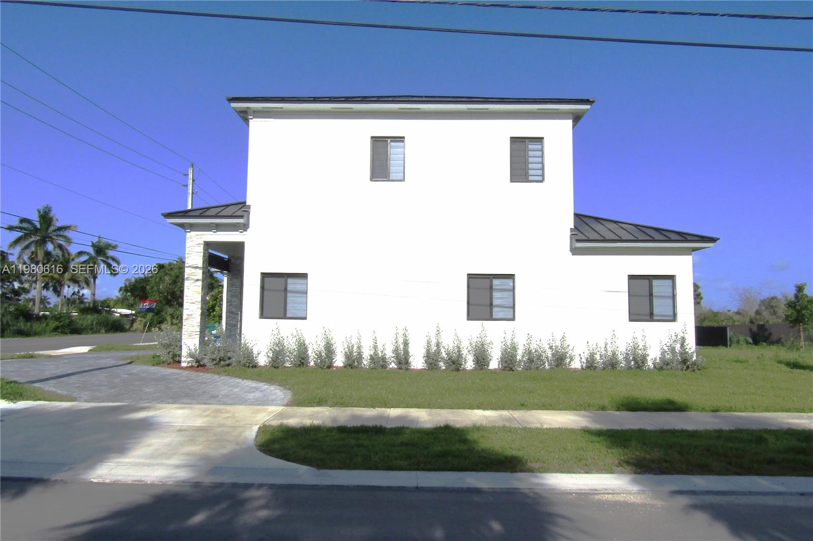 11998 Southwest 232nd Street Miami, FL 33170 - Photo 23 of 26 a front view of a house with a yard