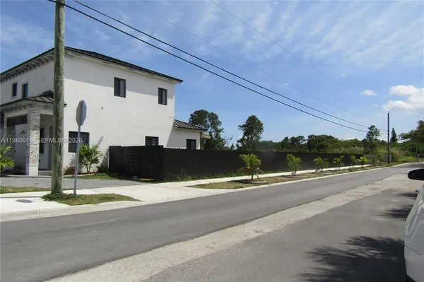 a view of a street with houses