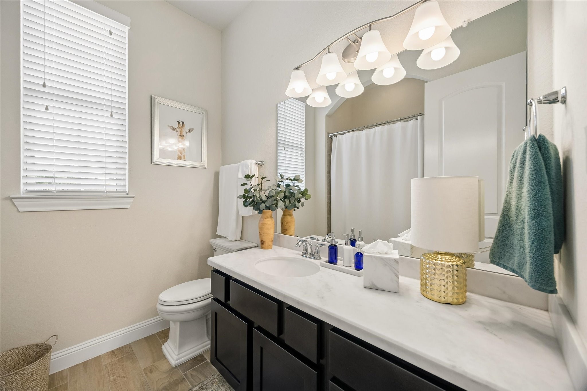 7418 Kearney Hill Lane Spring, TX 77389 - Photo 17 of 35 The spacious en-suite full bathroom features a tub/shower, a large mirror, and plentiful countertop space.