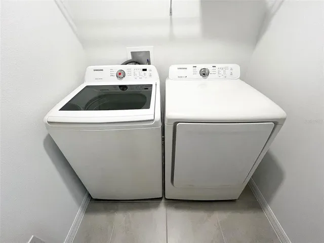 a utility room with dryer and washer
