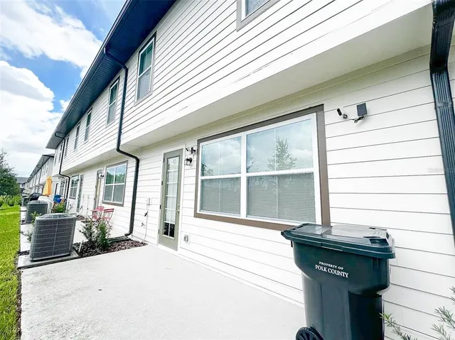 a view of a house with a potted plant