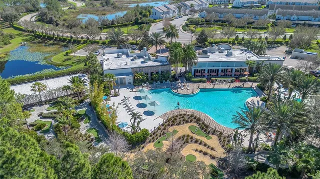 a view of swimming pool with outdoor seating
