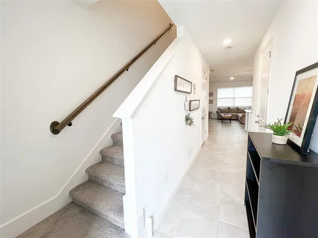 a view of a hallway with seating area