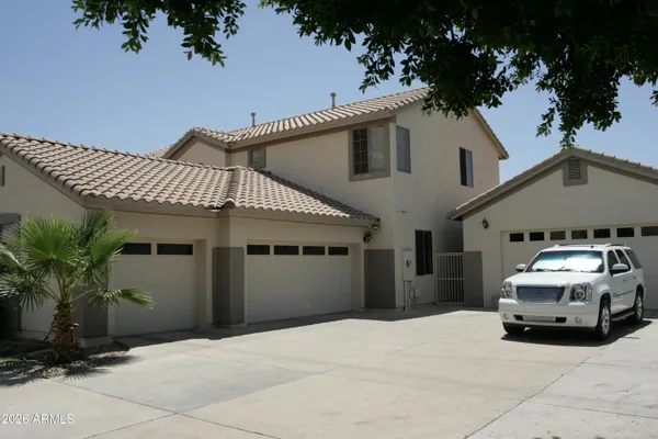 a car parked in front of white house