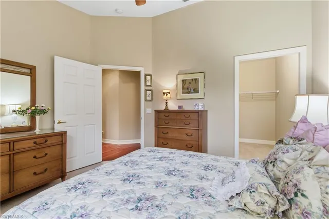 a bedroom with a bed and a dresser in it