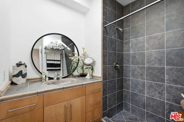 a bathroom with a sink and a mirror