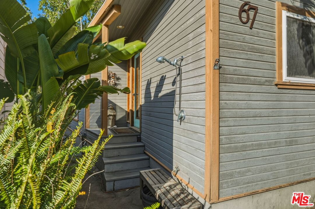 67 Paradise Cove Road Malibu, CA 90265 - Photo 21 of 45 a view of a pathway of a house with a tree