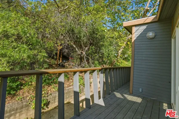 a view of balcony with wooden floor