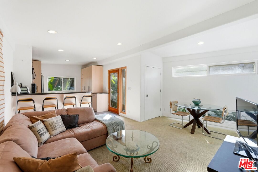 67 Paradise Cove Road Malibu, CA 90265 - Photo 7 of 45 a living room with furniture a table and a potted plant