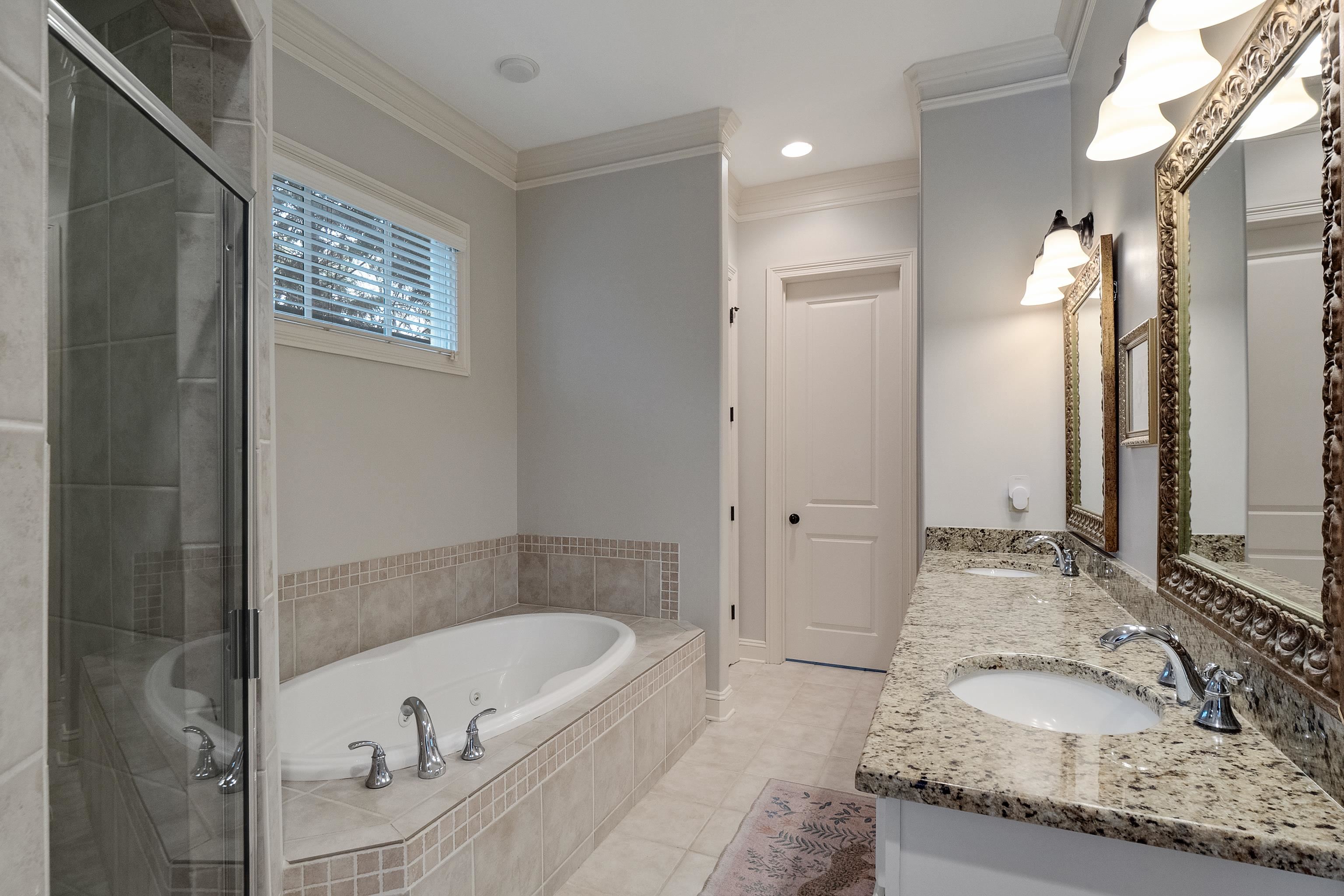 187 Ridgefield Road Memphis, TN 38111 - Photo 12 of 34 a bathroom with a granite countertop tub sink and mirror