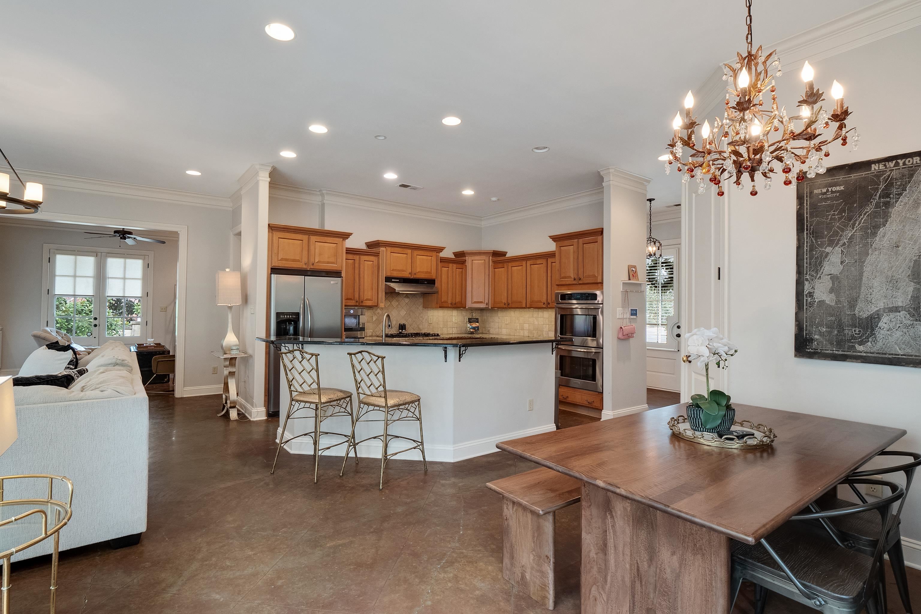 187 Ridgefield Road Memphis, TN 38111 - Photo 14 of 34 a living room with kitchen island furniture and a chandelier