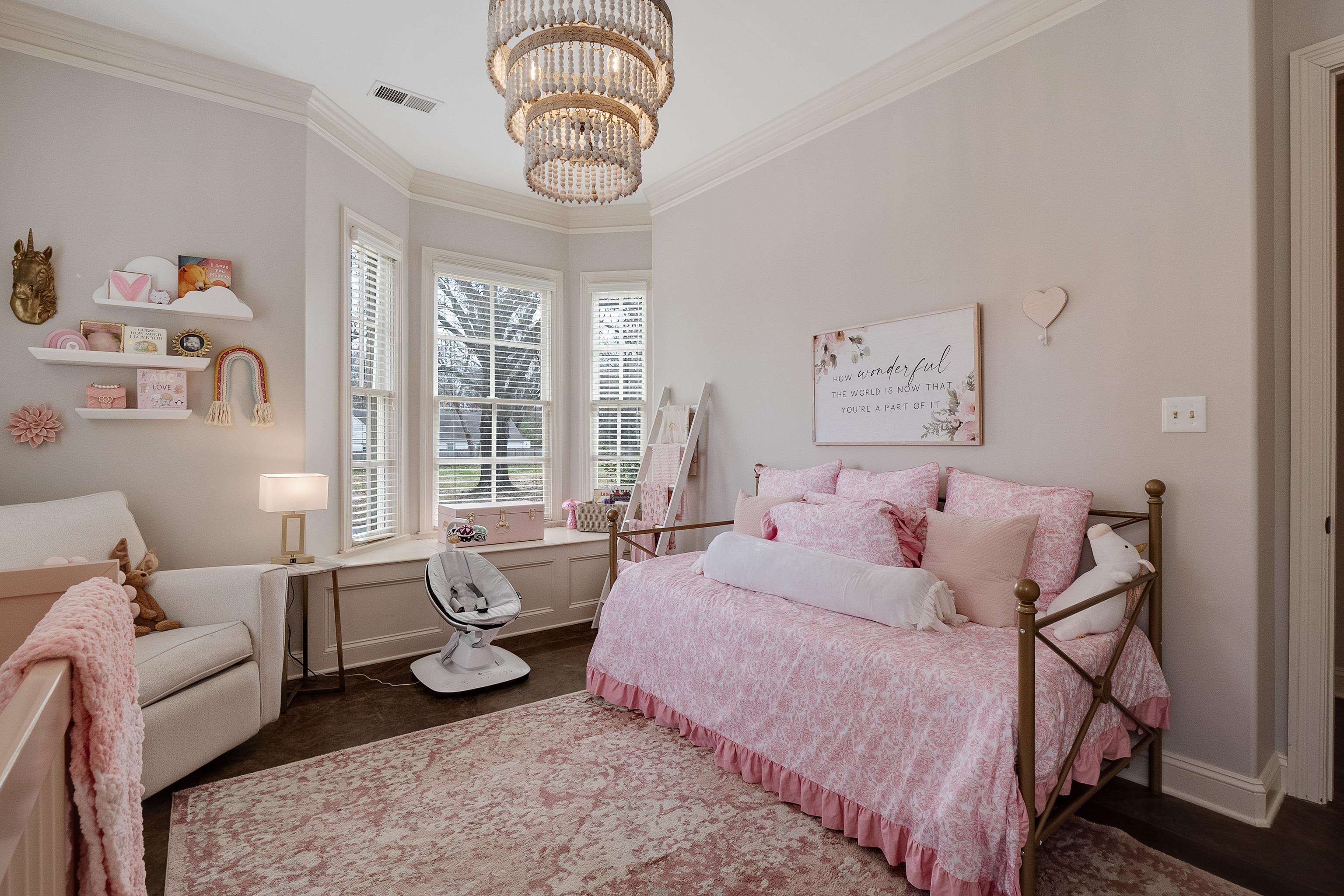 187 Ridgefield Road Memphis, TN 38111 - Photo 21 of 34 a spacious bedroom with a bed a couch and large window