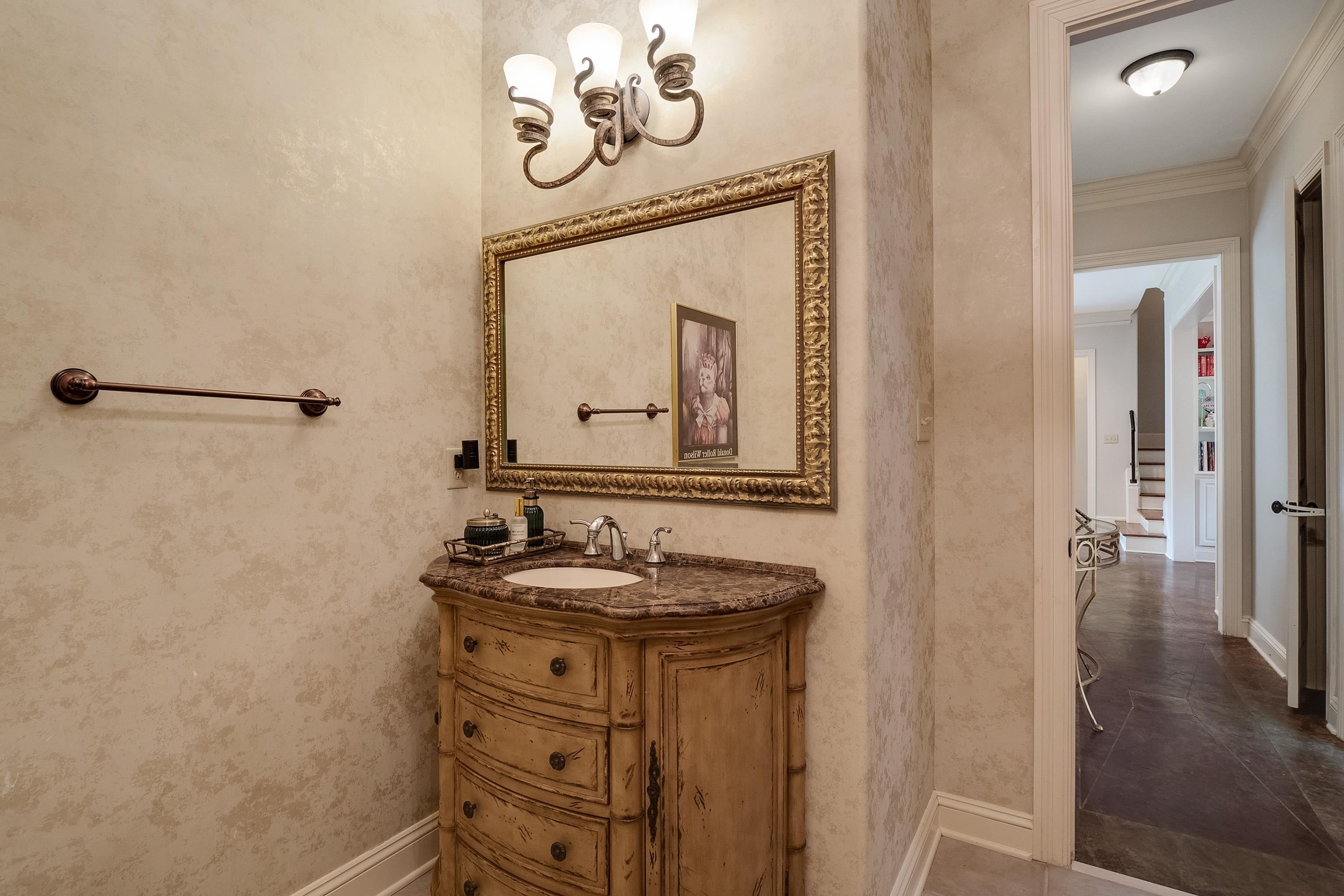 187 Ridgefield Road Memphis, TN 38111 - Photo 22 of 34 a bathroom with a sink a mirror and a shower