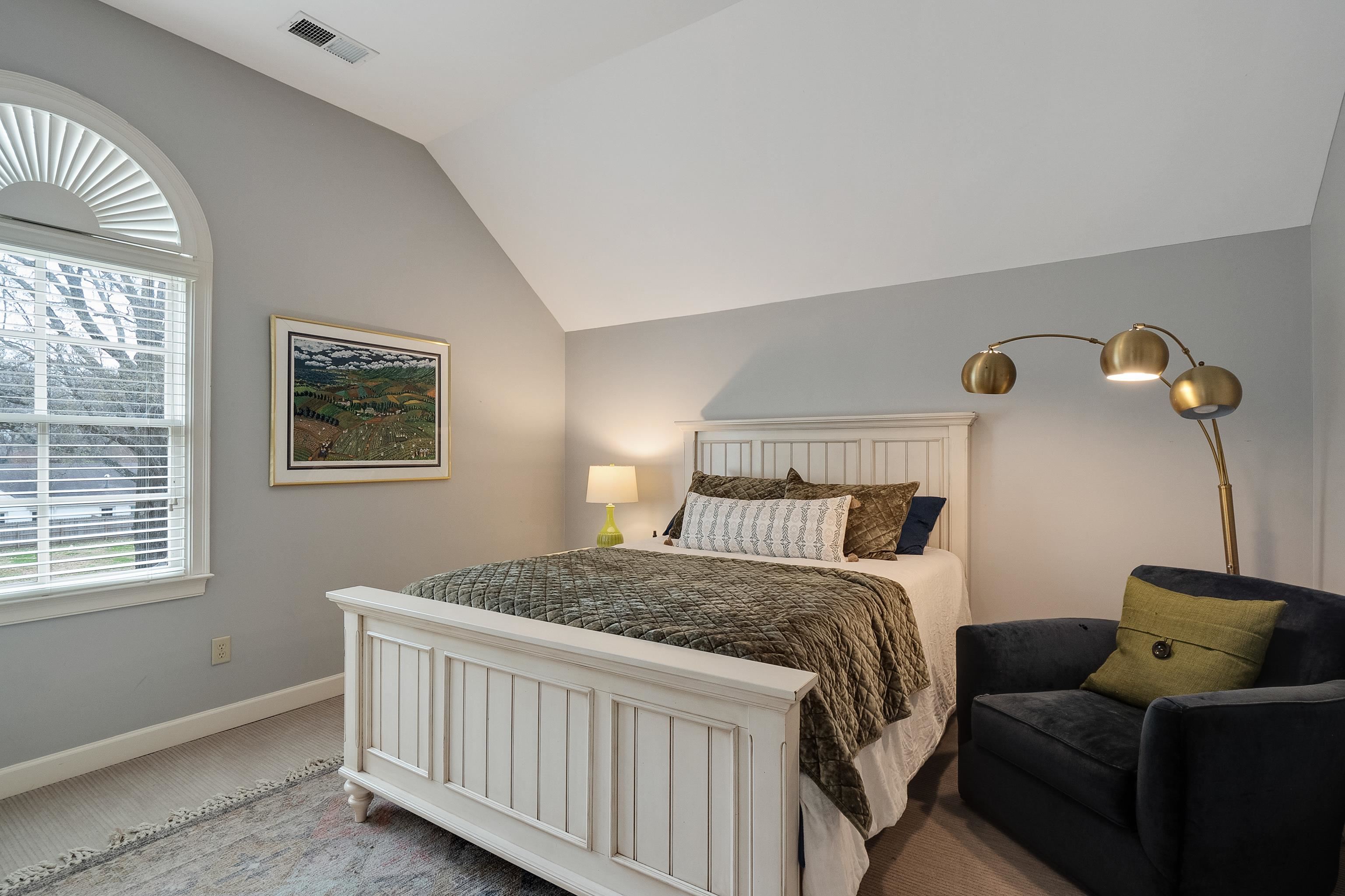 187 Ridgefield Road Memphis, TN 38111 - Photo 26 of 34 a bedroom with a bed and wooden floor