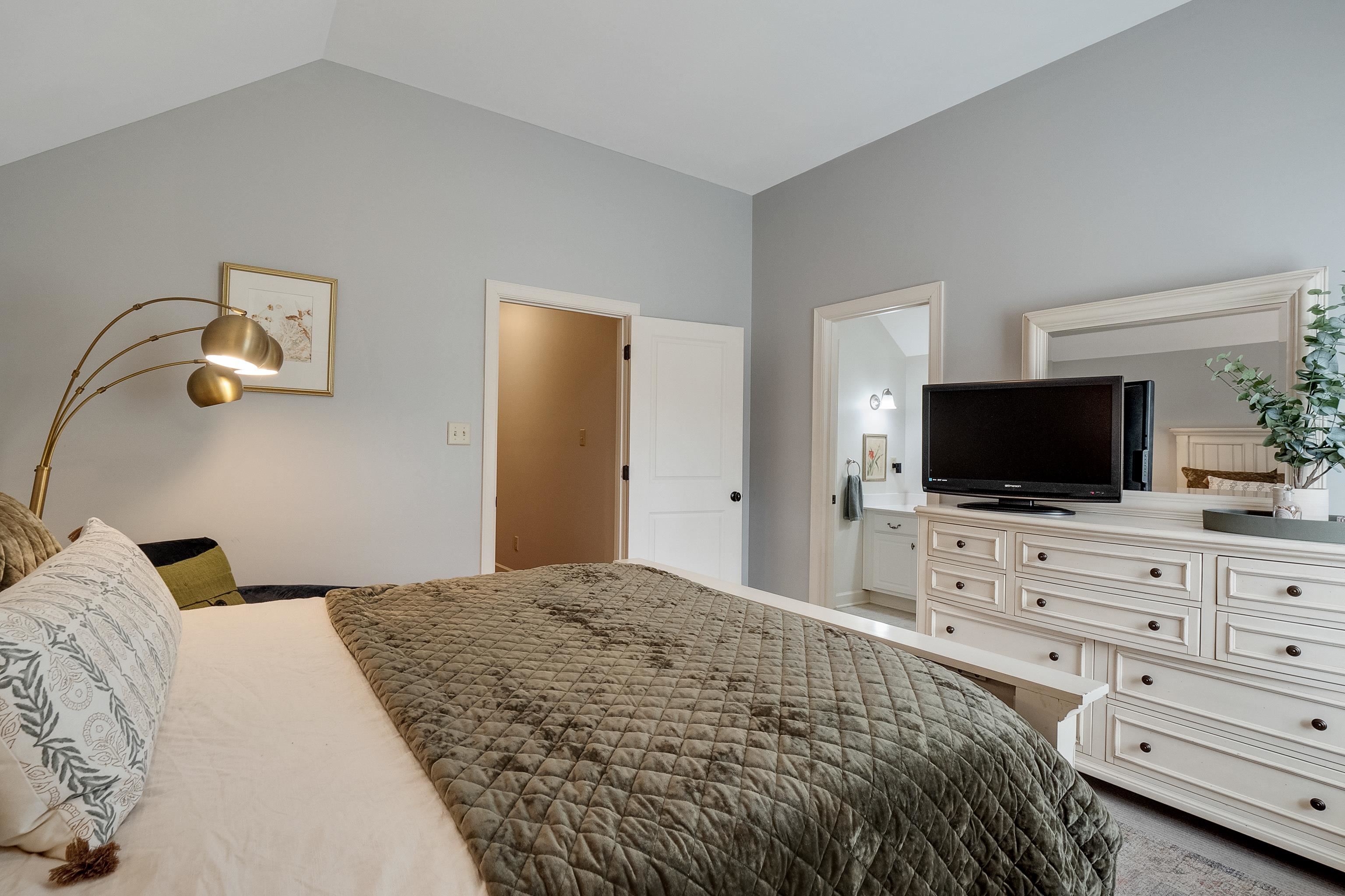 187 Ridgefield Road Memphis, TN 38111 - Photo 27 of 34 a bedroom with a bed and a flat screen tv