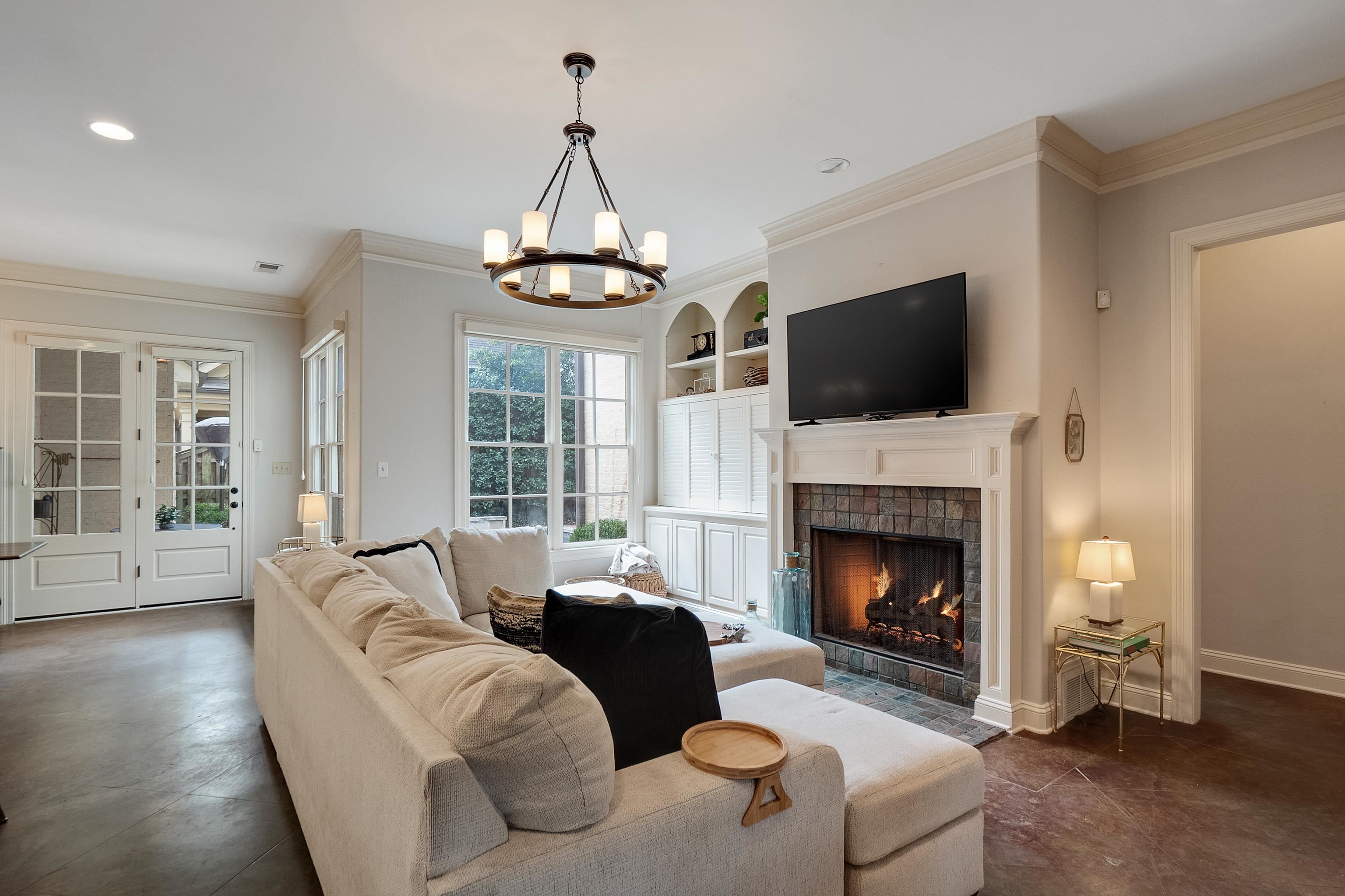 187 Ridgefield Road Memphis, TN 38111 - Photo 28 of 34 a living room with furniture a flat screen tv and a fireplace