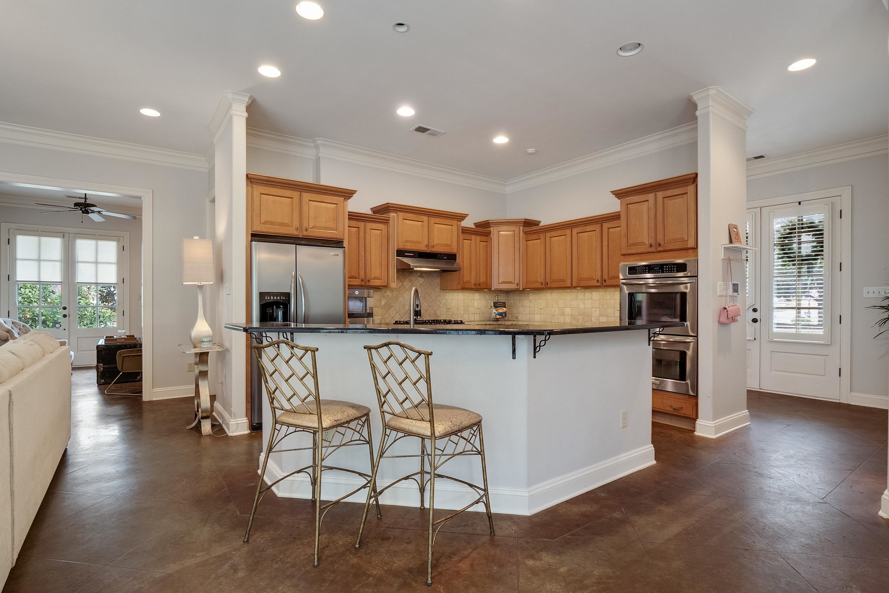 187 Ridgefield Road Memphis, TN 38111 - Photo 5 of 34 a kitchen with stainless steel appliances granite countertop a refrigerator stove microwave and white cabinets