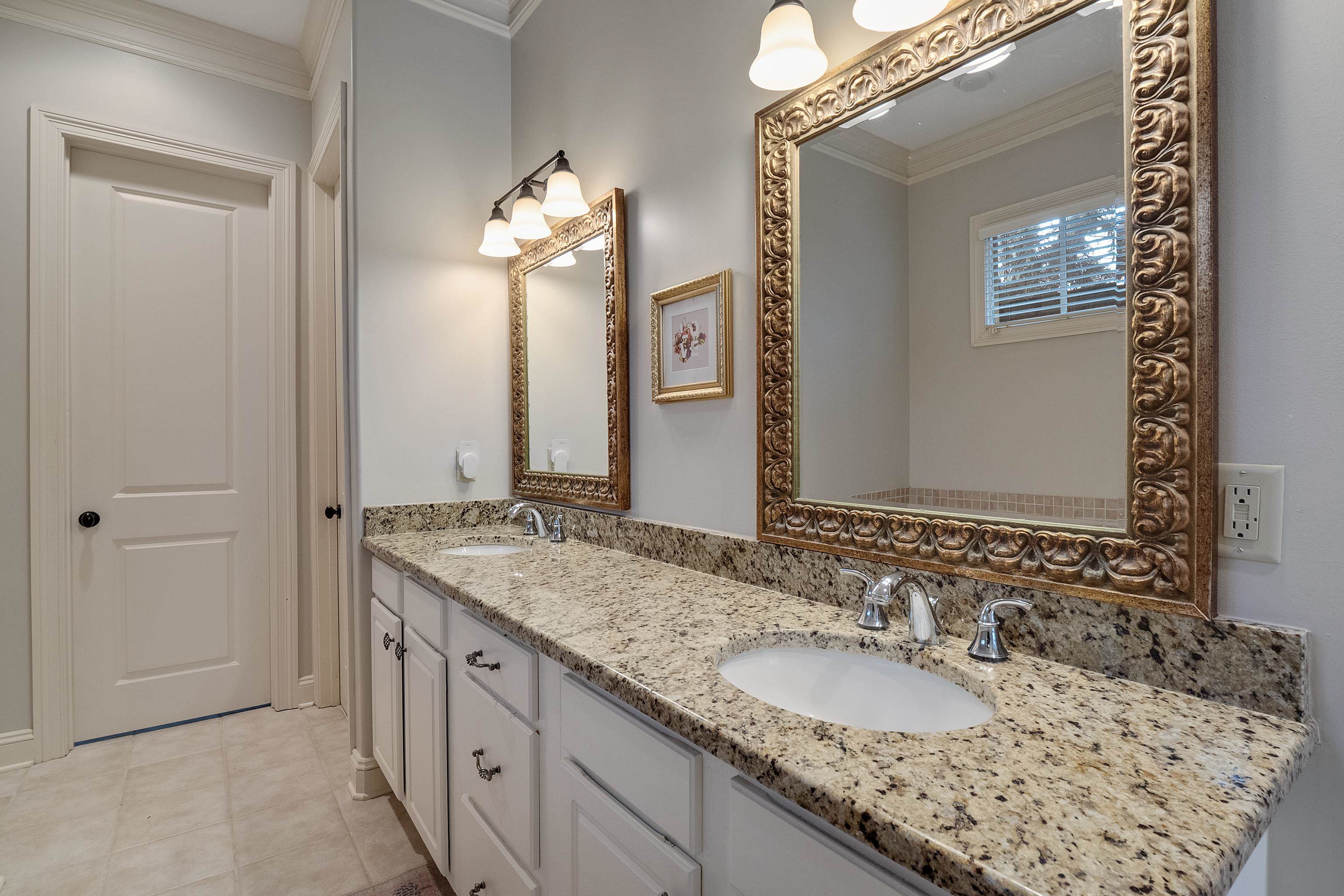 187 Ridgefield Road Memphis, TN 38111 - Photo 7 of 34 a bathroom with a granite countertop sink and a mirror