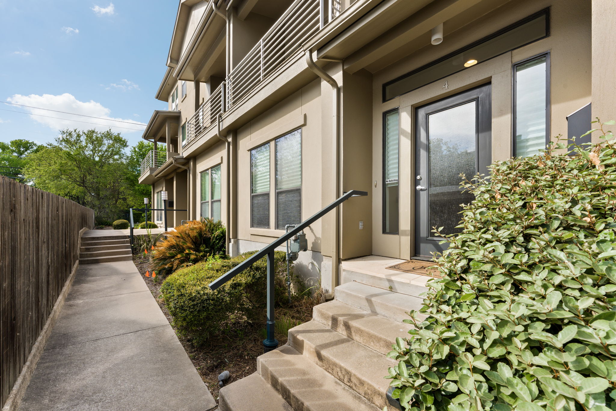 1305 Exposition Boulevard, Unit 4 Austin, TX 78703 - Photo 1 of 29 a front view of a house with a yard