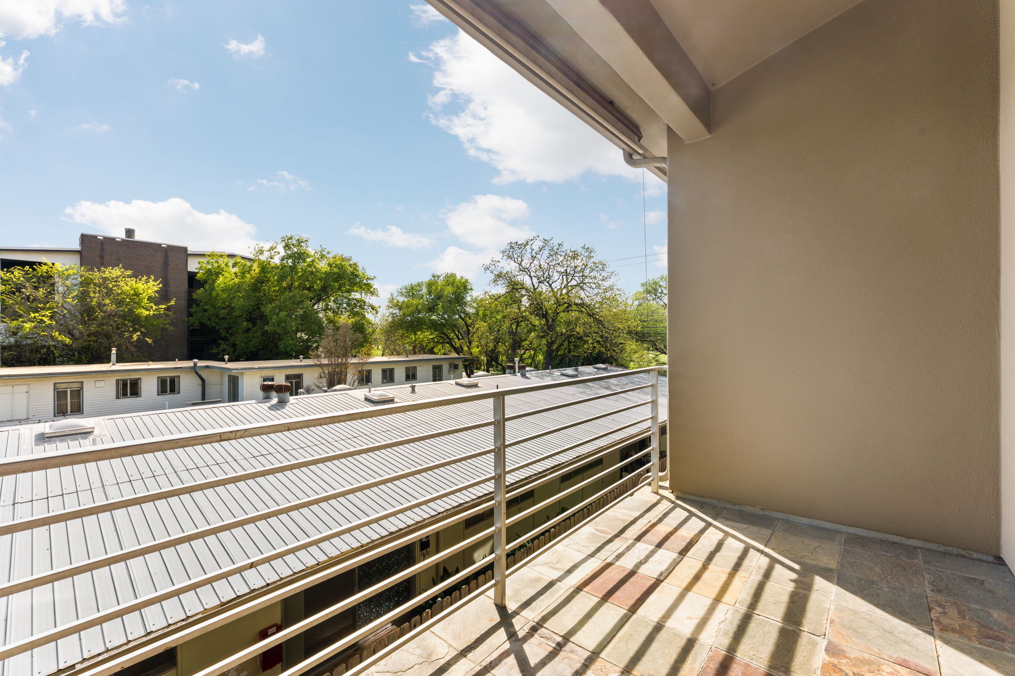 1305 Exposition Boulevard, Unit 4 Austin, TX 78703 - Photo 12 of 29 a view of a balcony with a yard