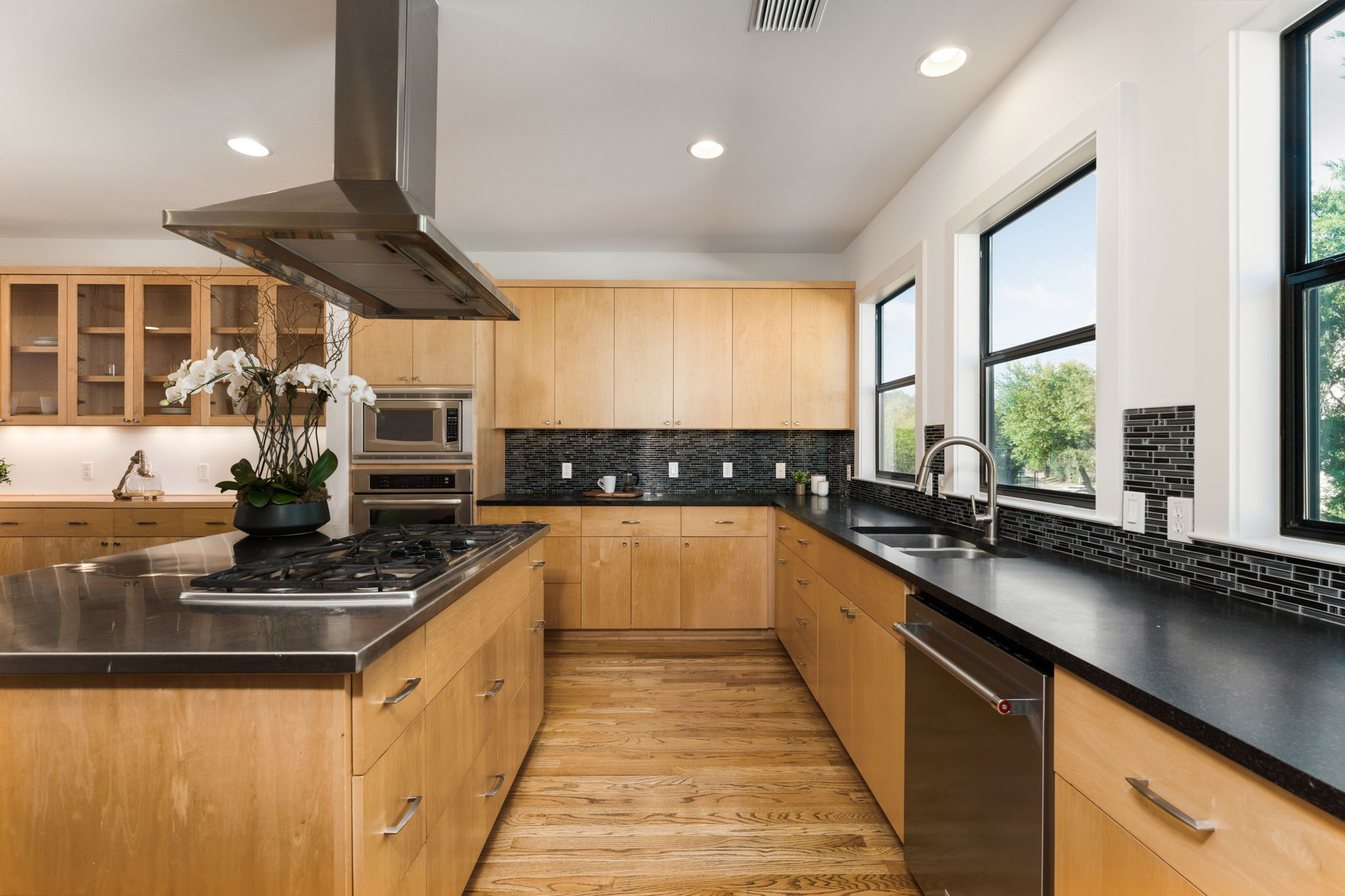 1305 Exposition Boulevard, Unit 4 Austin, TX 78703 - Photo 16 of 29 a kitchen with stainless steel appliances a sink stove and cabinets