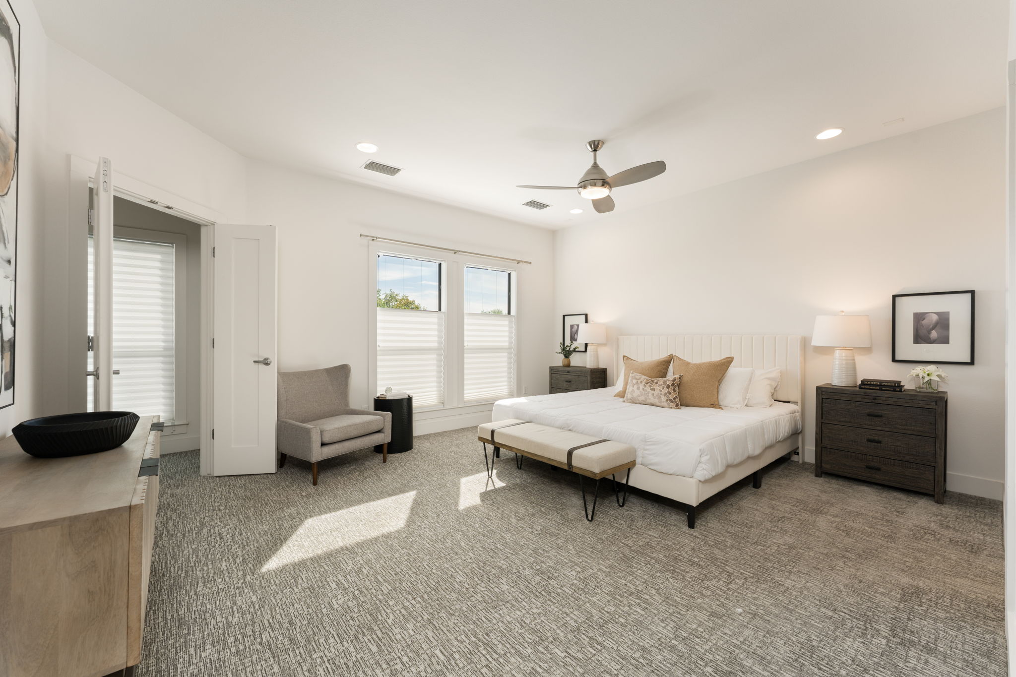 1305 Exposition Boulevard, Unit 4 Austin, TX 78703 - Photo 18 of 29 a spacious bedroom with a bed and couch
