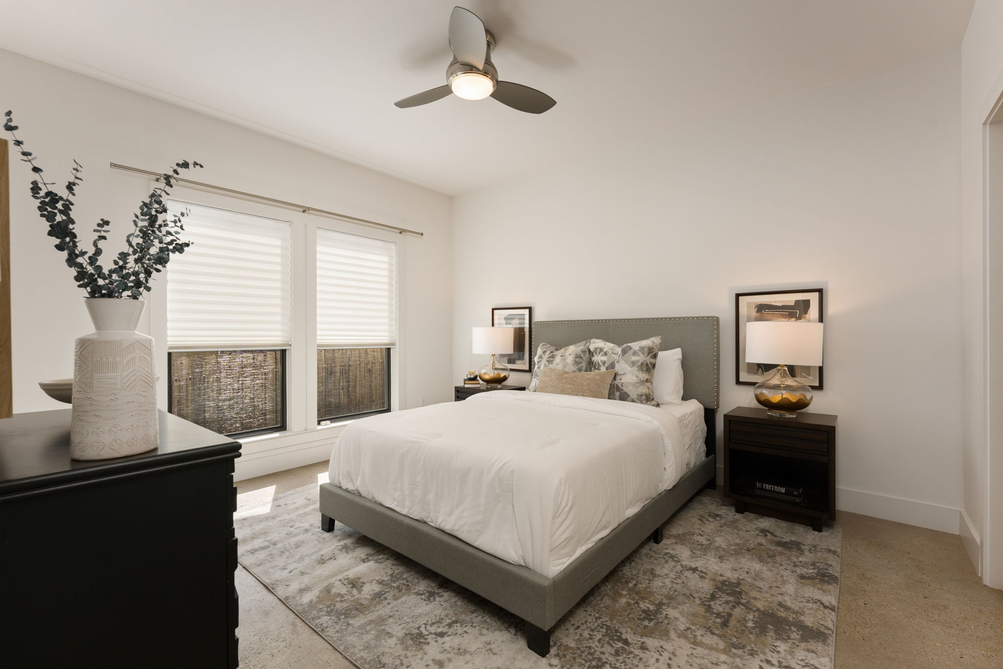 1305 Exposition Boulevard, Unit 4 Austin, TX 78703 - Photo 22 of 29 a bedroom with a large bed and a potted plant