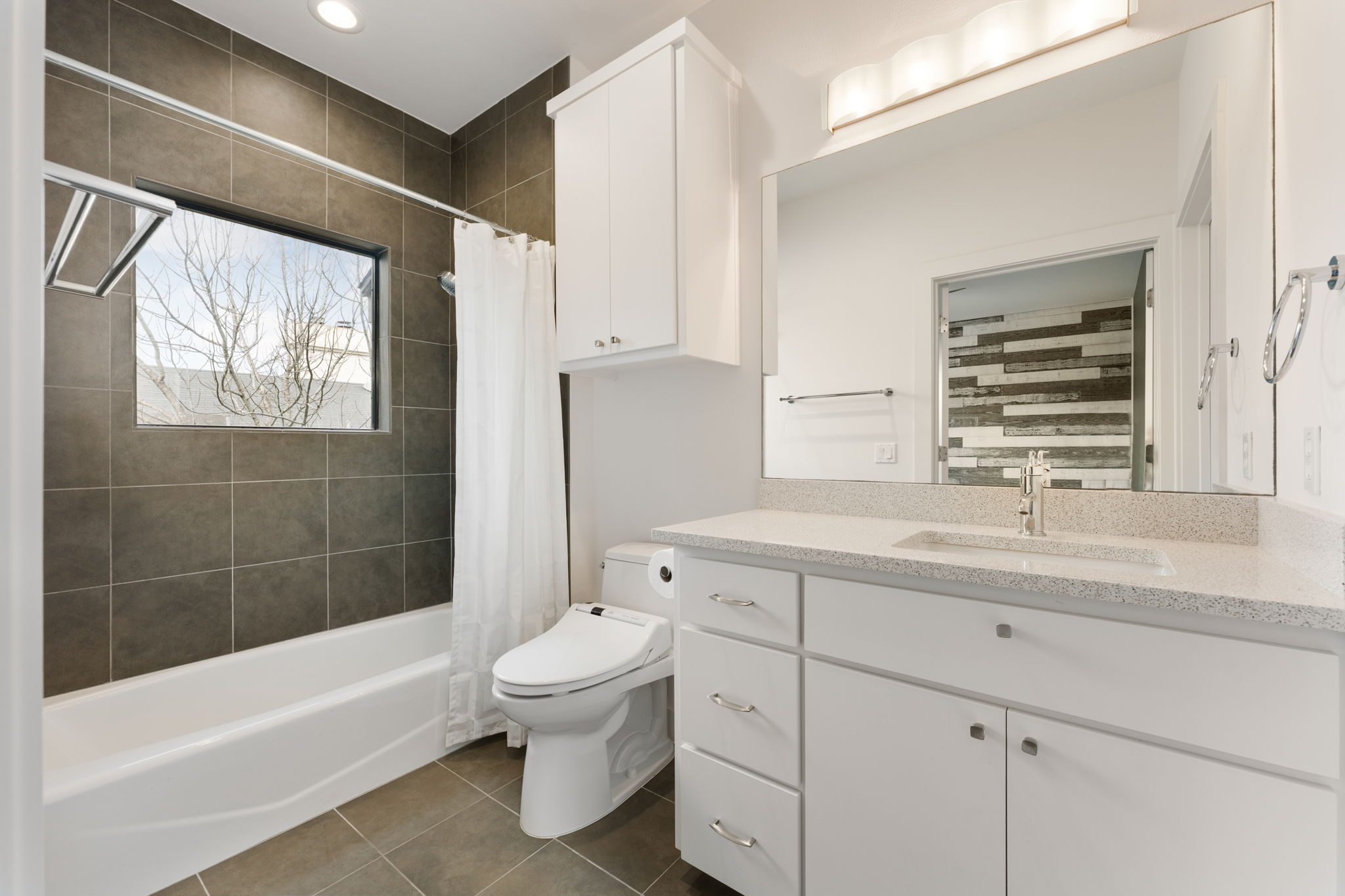 1305 Exposition Boulevard, Unit 4 Austin, TX 78703 - Photo 24 of 29 a bathroom with a sink a toilet and bathtub