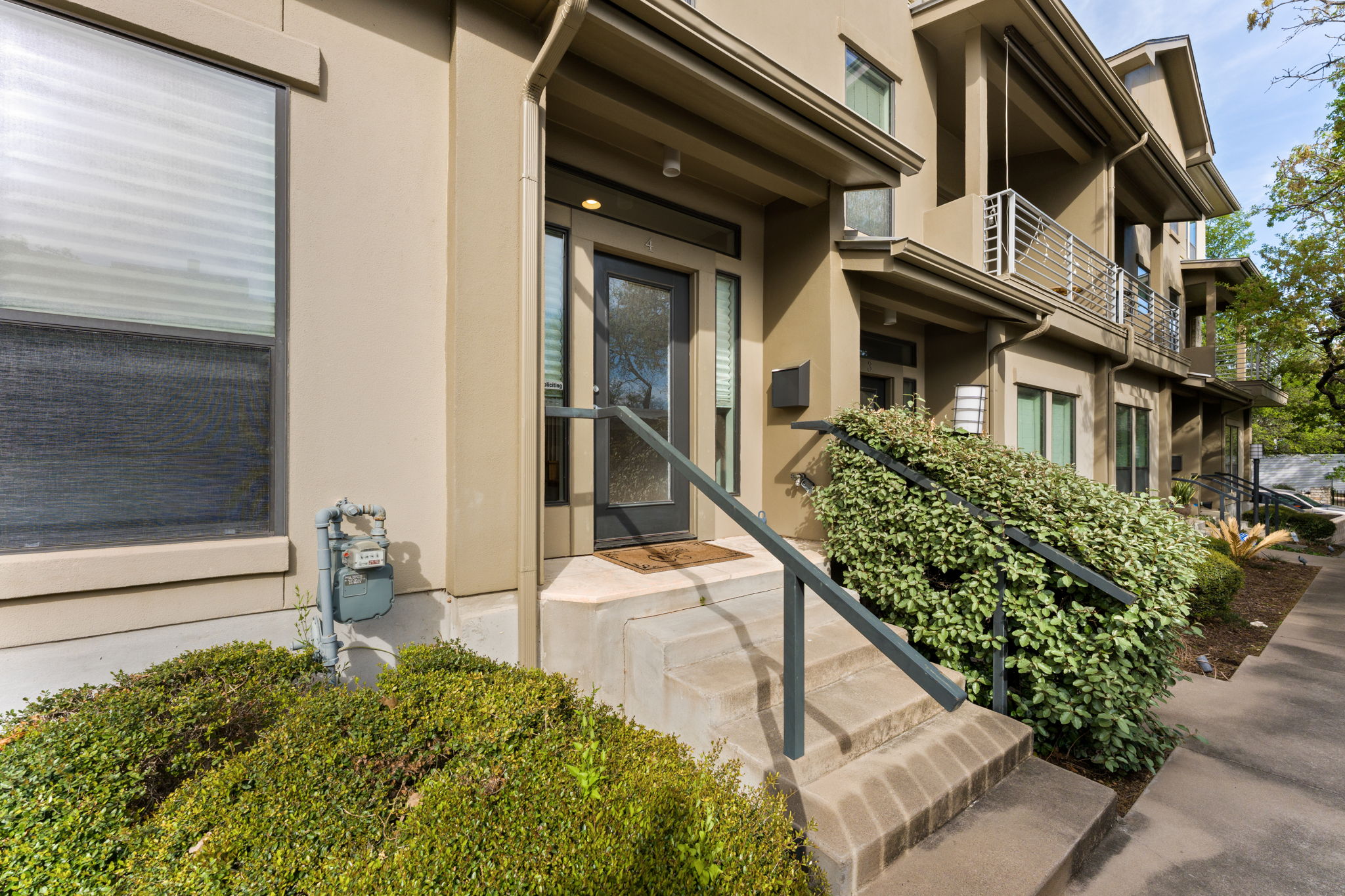 1305 Exposition Boulevard, Unit 4 Austin, TX 78703 - Photo 27 of 29 a view of a house with backyard and sitting area