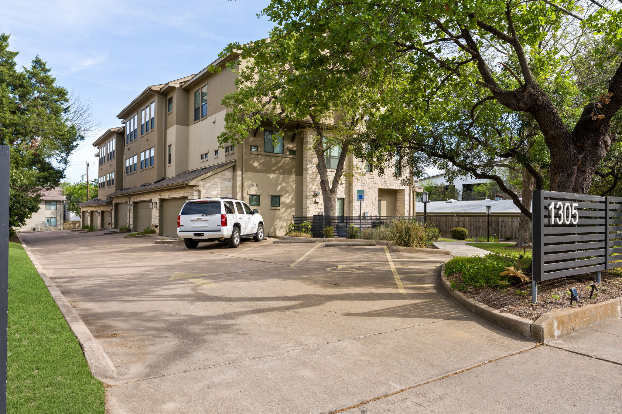 1305 Exposition Boulevard, Unit 4 Austin, TX 78703 - Photo 28 of 29 a car parked in front of a building