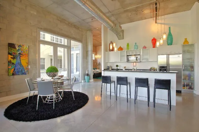 a dining room with furniture and wooden floor