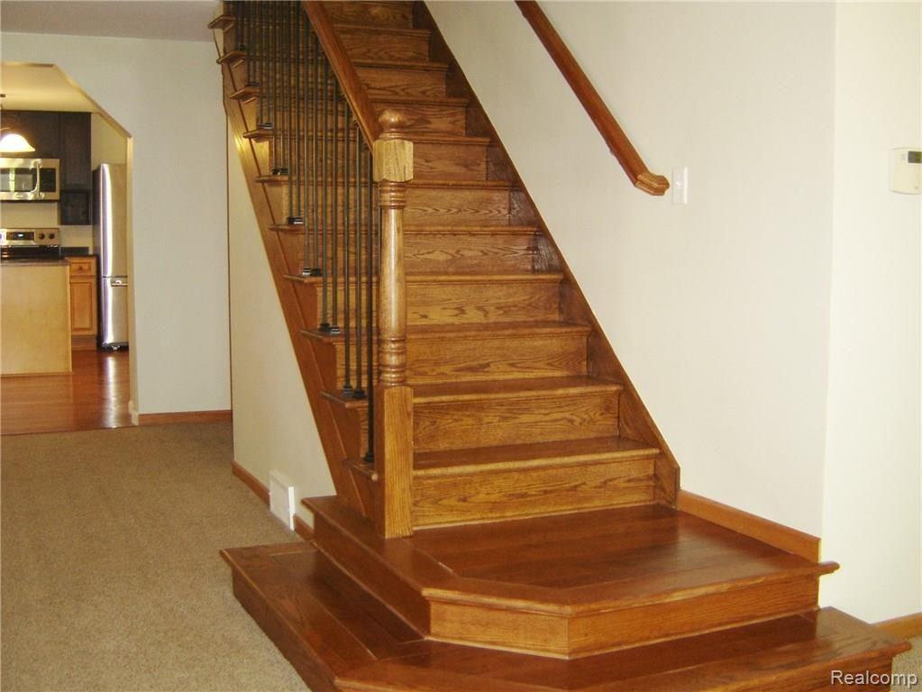 4378 Chase Lake Road Howell, MI 48855 - Photo 12 of 19 Beautiful wood staircase