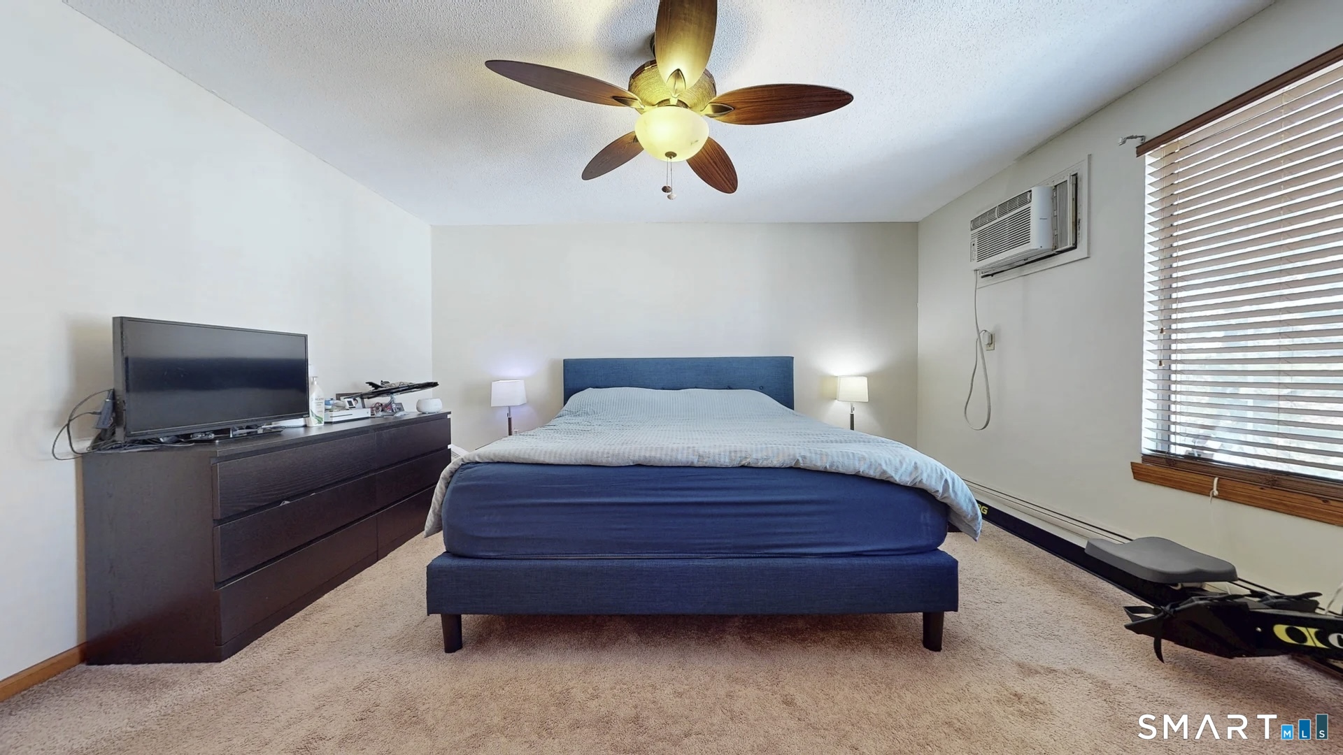 26-5 Guiel Place, Unit 8 Meriden, CT 06450 - Photo 12 of 14 a bedroom with a bed and a ceiling fan