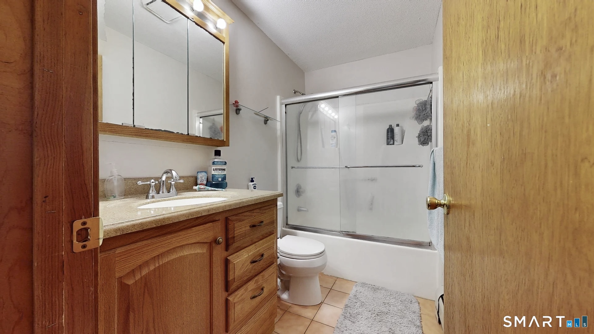 26-5 Guiel Place, Unit 8 Meriden, CT 06450 - Photo 13 of 14 a bathroom with a sink toilet and shower